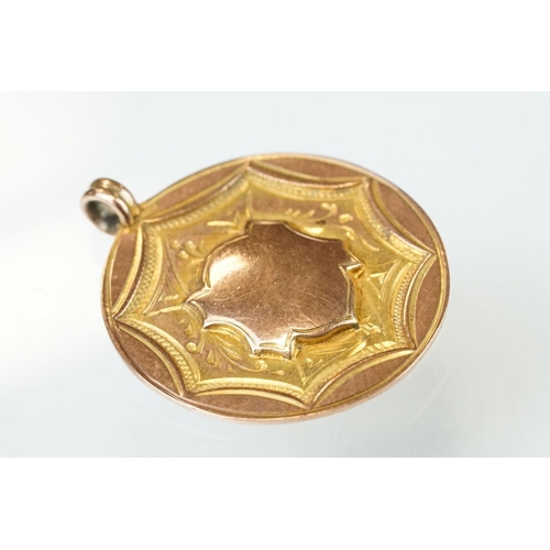 59 - 9ct rose gold medallion, blank cartouche to centre, engraved scroll decoration, hallmarked Birmingha... 