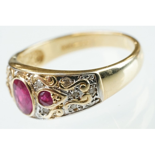 61 - Ruby and diamond 14ct yellow gold ring, the principal oval mixed cut ruby measuring approx 6mm x 4mm... 