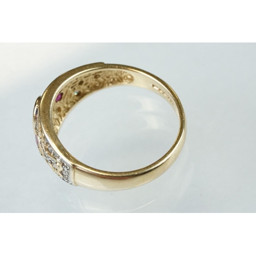 61 - Ruby and diamond 14ct yellow gold ring, the principal oval mixed cut ruby measuring approx 6mm x 4mm... 