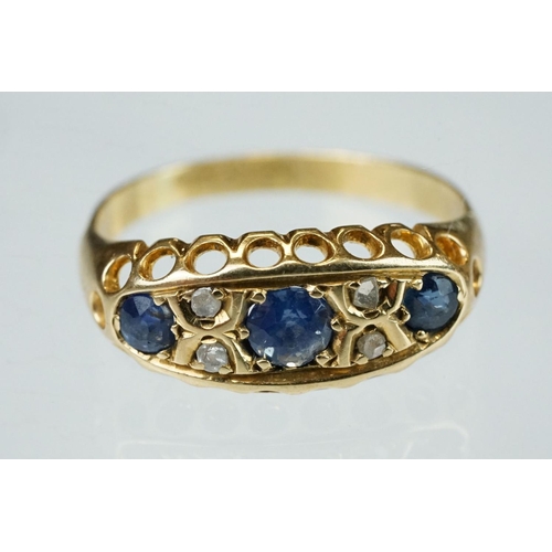 63 - Early 20th century sapphire, blue spinel and diamond 18ct yellow gold boat head ring, centre round m... 