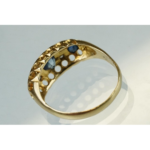 63 - Early 20th century sapphire, blue spinel and diamond 18ct yellow gold boat head ring, centre round m... 