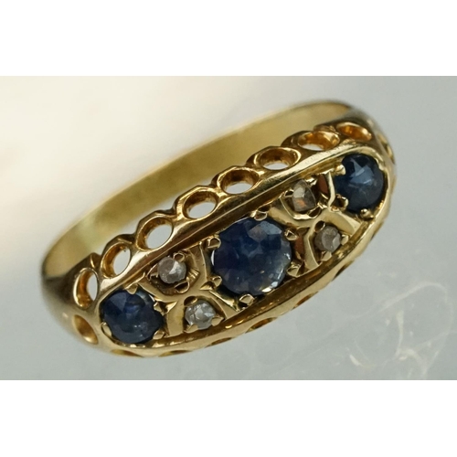 63 - Early 20th century sapphire, blue spinel and diamond 18ct yellow gold boat head ring, centre round m... 