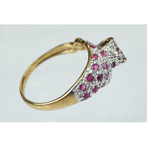 66 - Ruby and diamond 9ct yellow gold ring modelled as a leopard, small round mixed cut rubies, four smal... 