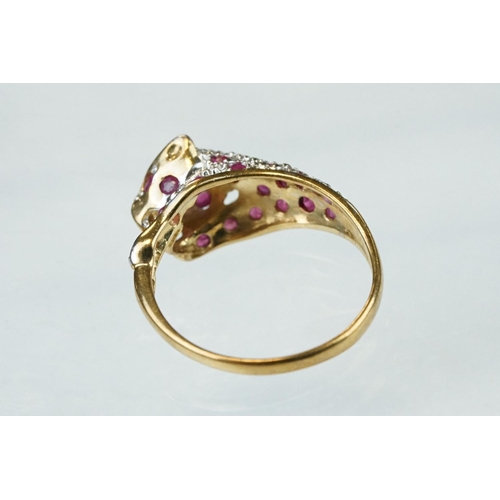 66 - Ruby and diamond 9ct yellow gold ring modelled as a leopard, small round mixed cut rubies, four smal... 