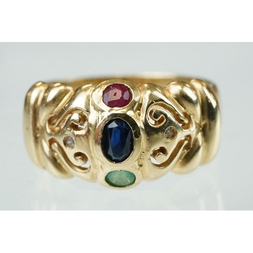 68 - Ruby, sapphire, emerald and diamond 14t yellow gold ring, the oval mixed cut sapphire measuring appr... 