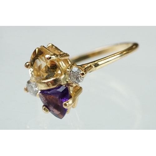 69 - Amethyst, citrine and diamond 14ct yellow gold ring, the trillion cut amethyst measuring approx 5.6m... 