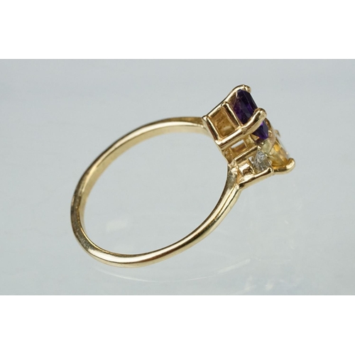 69 - Amethyst, citrine and diamond 14ct yellow gold ring, the trillion cut amethyst measuring approx 5.6m... 