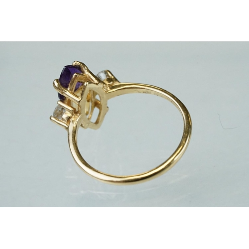 69 - Amethyst, citrine and diamond 14ct yellow gold ring, the trillion cut amethyst measuring approx 5.6m... 