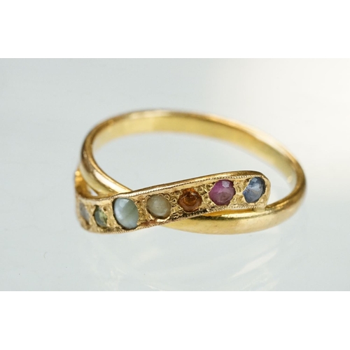 70 - Gem set yellow metal crossover ring, small round mixed cut quartz, pink sapphire, peridot, cats eye ... 