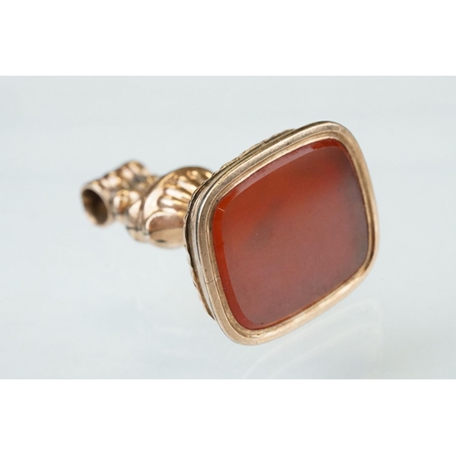 82 - 19th century carnelian gold plated fob, the bevelled carnelian measuring approx 23mm x 19mm, rubover... 