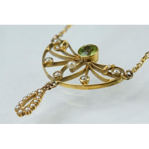 84 - Edwardian peridot and seed pearl yellow metal pendant necklace, the round mixed cut peridot diameter... 