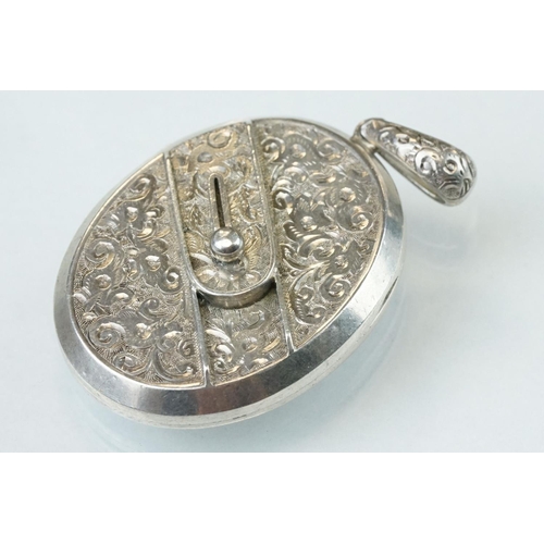 88 - Victorian style silver oval locket pendant, repoussé decoration together with an unmarked silver Vic... 