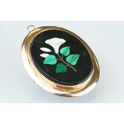 10 - Pietra dura rose metal brooch, the oval panel set with floral design, rubover set, plain polished su... 