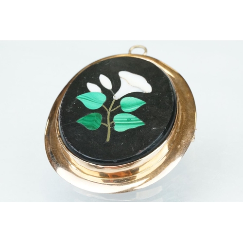 10 - Pietra dura rose metal brooch, the oval panel set with floral design, rubover set, plain polished su... 