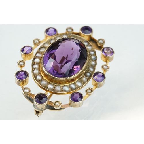 11 - Late 19th century amethyst and seed pearl 9ct yellow gold brooch, the principal oval mixed cut ameth... 