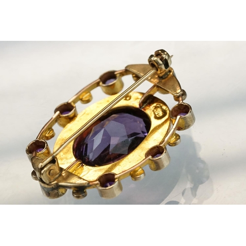 11 - Late 19th century amethyst and seed pearl 9ct yellow gold brooch, the principal oval mixed cut ameth... 