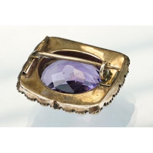 13 - Amethyst and pearl yellow metal brooch, the oval mixed cut amethyst measuring approx 13.5mm x 18.5mm... 