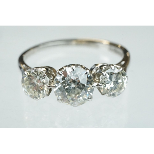 15 - Diamond 18ct white gold three stone ring, the central round brilliant cut diamond weighing approx 1.... 