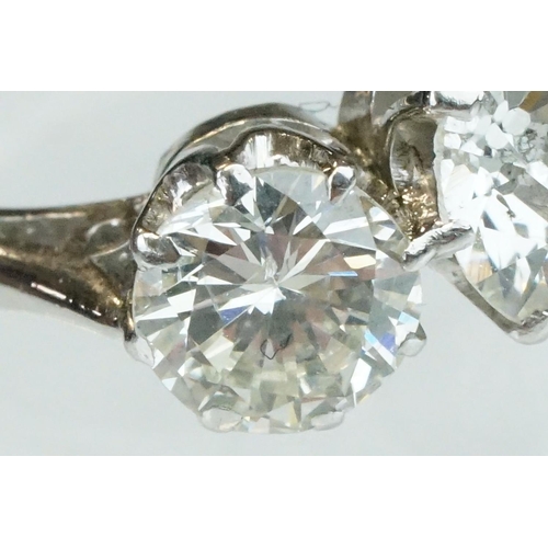 15 - Diamond 18ct white gold three stone ring, the central round brilliant cut diamond weighing approx 1.... 