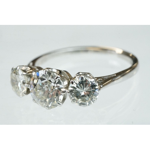 15 - Diamond 18ct white gold three stone ring, the central round brilliant cut diamond weighing approx 1.... 