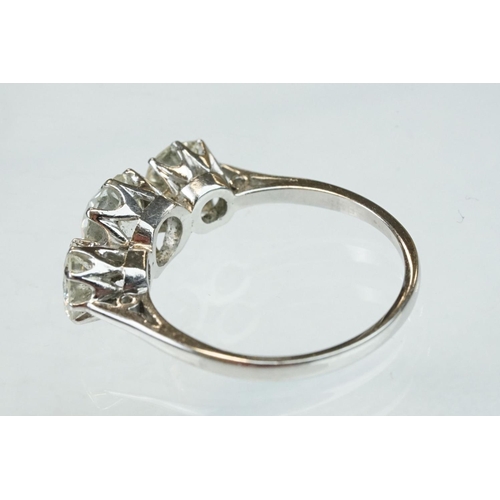 15 - Diamond 18ct white gold three stone ring, the central round brilliant cut diamond weighing approx 1.... 