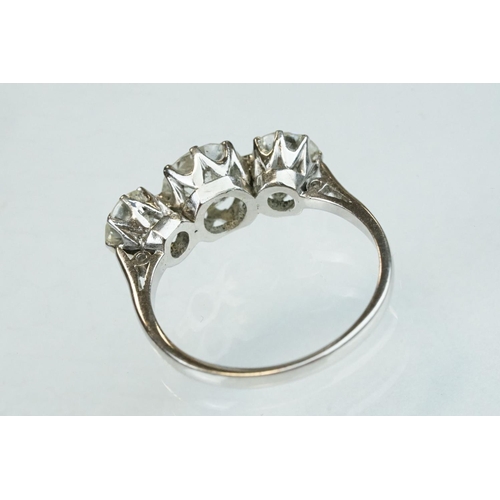 15 - Diamond 18ct white gold three stone ring, the central round brilliant cut diamond weighing approx 1.... 