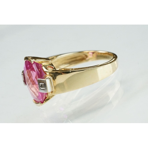 21 - Pink sapphire and diamond yellow and white gold ring, oval mixed cut pink sapphire measuring approx ... 