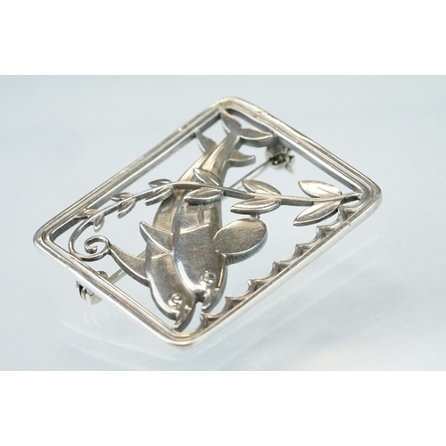 26 - Arno Malinowski for Georg Jensen silver brooch, pattern no. 251, modelled as a pair of diving dolphi... 