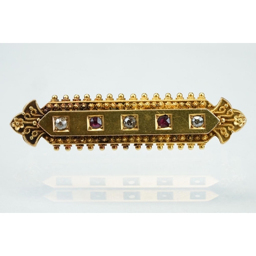 29 - Late 19th century Etruscan revival diamond and ruby 15ct yellow gold brooch, three small old cut dia... 