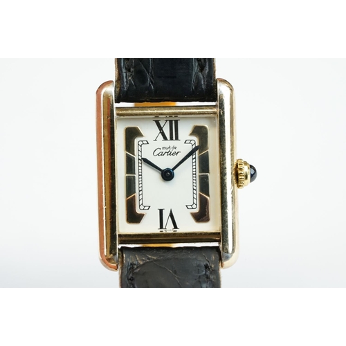 371A - Must de Cartier tank vermeil silver gilt wristwatch, cream dial with black Roman numerals and gilt b... 