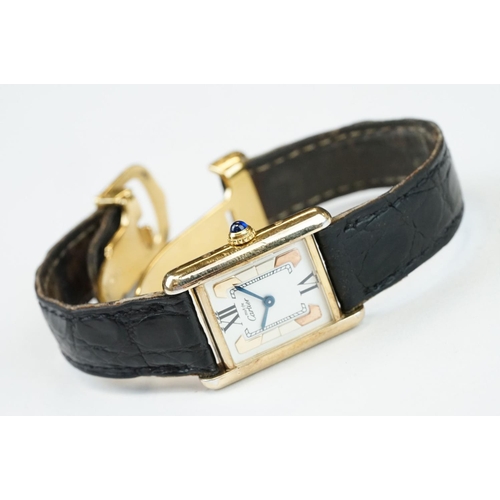 371A - Must de Cartier tank vermeil silver gilt wristwatch, cream dial with black Roman numerals and gilt b... 