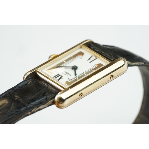 371A - Must de Cartier tank vermeil silver gilt wristwatch, cream dial with black Roman numerals and gilt b... 