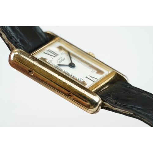 371A - Must de Cartier tank vermeil silver gilt wristwatch, cream dial with black Roman numerals and gilt b... 