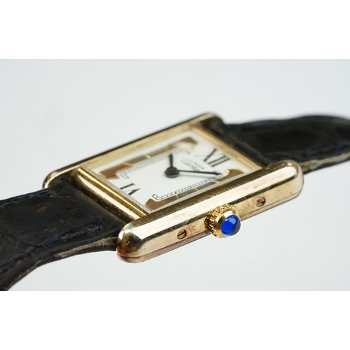 371A - Must de Cartier tank vermeil silver gilt wristwatch, cream dial with black Roman numerals and gilt b... 