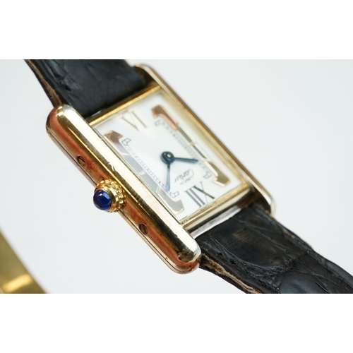 371A - Must de Cartier tank vermeil silver gilt wristwatch, cream dial with black Roman numerals and gilt b... 