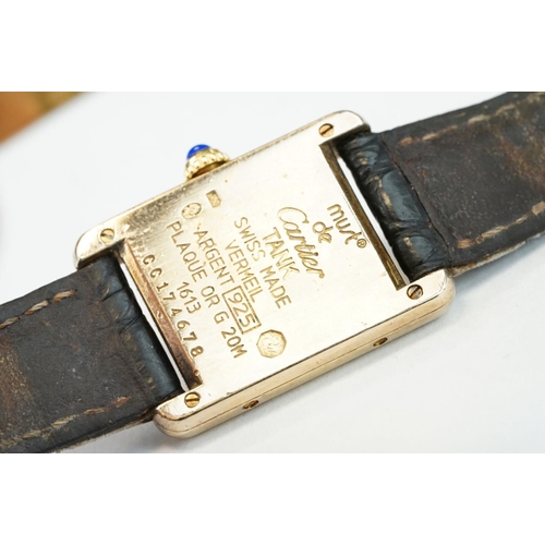 371A - Must de Cartier tank vermeil silver gilt wristwatch, cream dial with black Roman numerals and gilt b... 