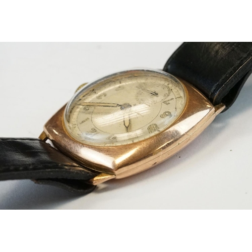 375 - 9ct Rose gold cased gents watch with cream dial and seconds dial, Arabic numerals and rolled gold st... 