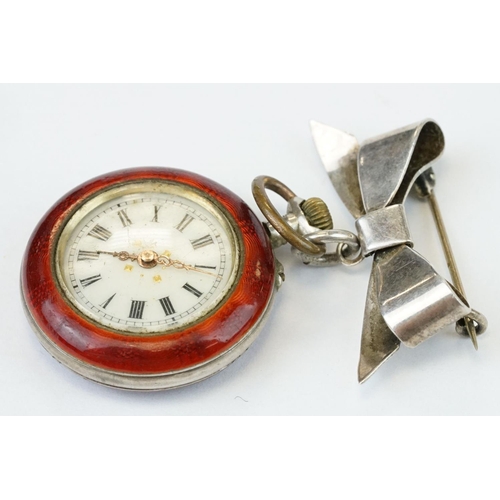 388 - Enamelled white metal top wind fob watch, white enamel dial with black Roman numerals, gilt poker ha... 