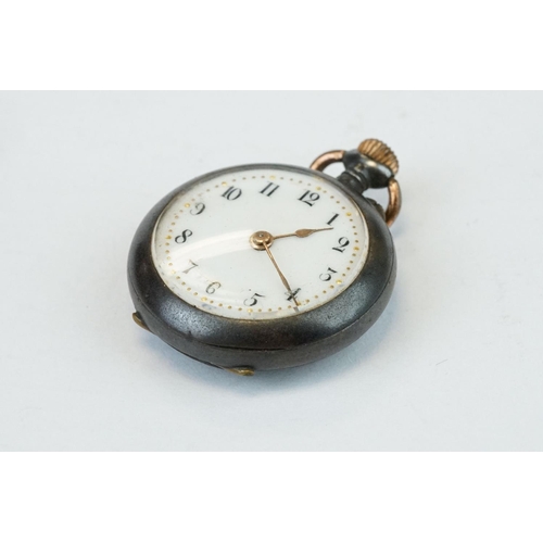 388 - Enamelled white metal top wind fob watch, white enamel dial with black Roman numerals, gilt poker ha... 