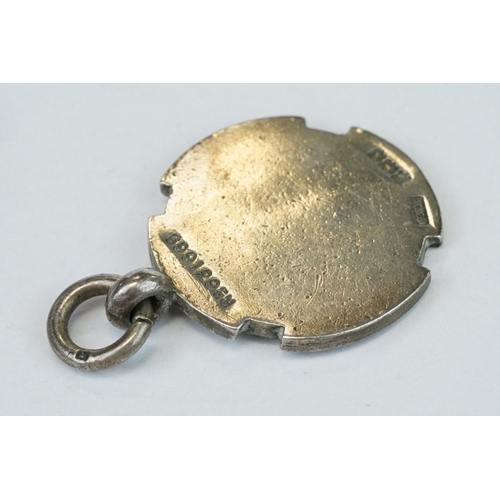 389A - Two silver fobs, a silver fob watch, an enamelled silver fob watch (af) and a late Victorian silver ... 