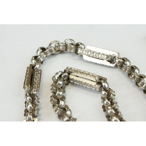 393 - Two Silver albert watch chains to include a silver curb link example, with clasp (stamped to each li... 