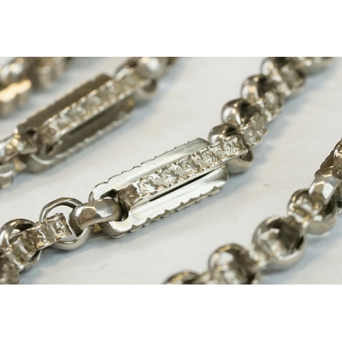 393 - Two Silver albert watch chains to include a silver curb link example, with clasp (stamped to each li... 