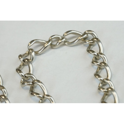 393 - Two Silver albert watch chains to include a silver curb link example, with clasp (stamped to each li... 