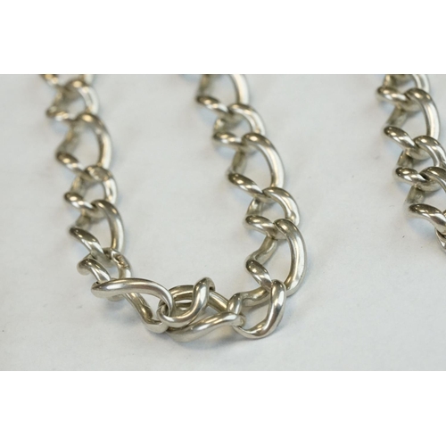 393 - Two Silver albert watch chains to include a silver curb link example, with clasp (stamped to each li... 