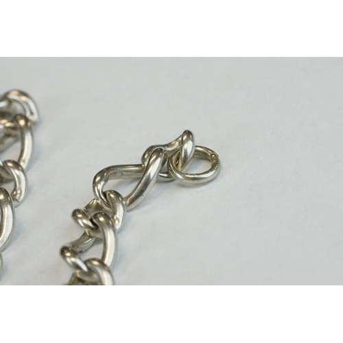 393 - Two Silver albert watch chains to include a silver curb link example, with clasp (stamped to each li... 