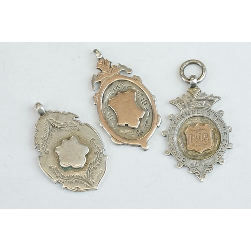 401 - 15 Silver hallmarked watch fobs, early to mid 20th century, featuring Chester hallmarked and sportin... 