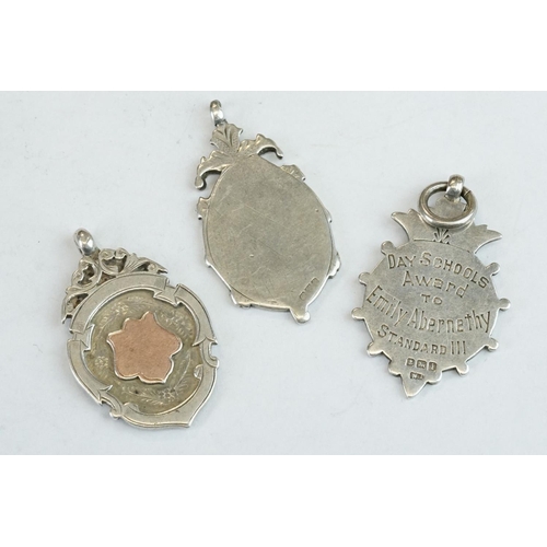 401 - 15 Silver hallmarked watch fobs, early to mid 20th century, featuring Chester hallmarked and sportin... 