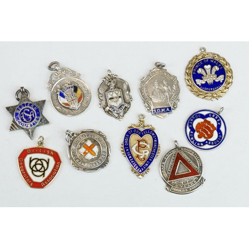 403 - Ten Silver hallmarked watch fobs, early to mid 20th century, with enamel decoration, featuring sport... 