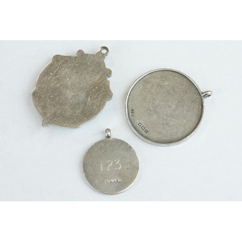 404 - 14 silver watch fobs and medals, mostly stamped sterling or silver, together with 3 white metal and ... 