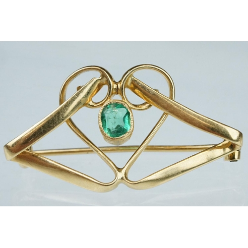 6 - Art Nouveau emerald unmarked yellow gold brooch, the central oval mixed cut emerald measuring approx... 